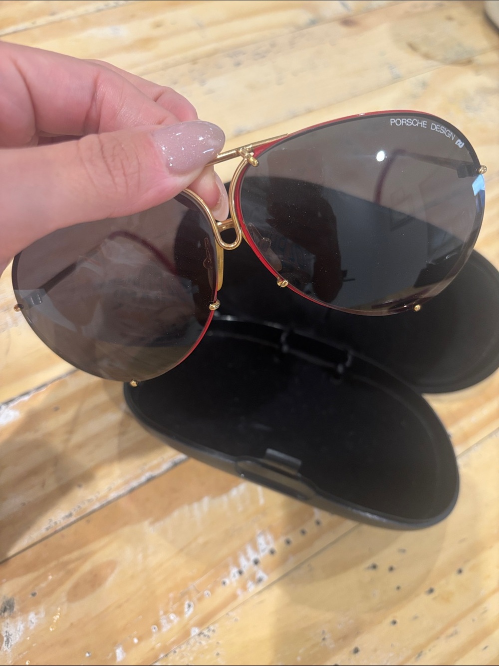 Porsche Design Gold Frame Sunglasses with Red Trim and Dark Lenses